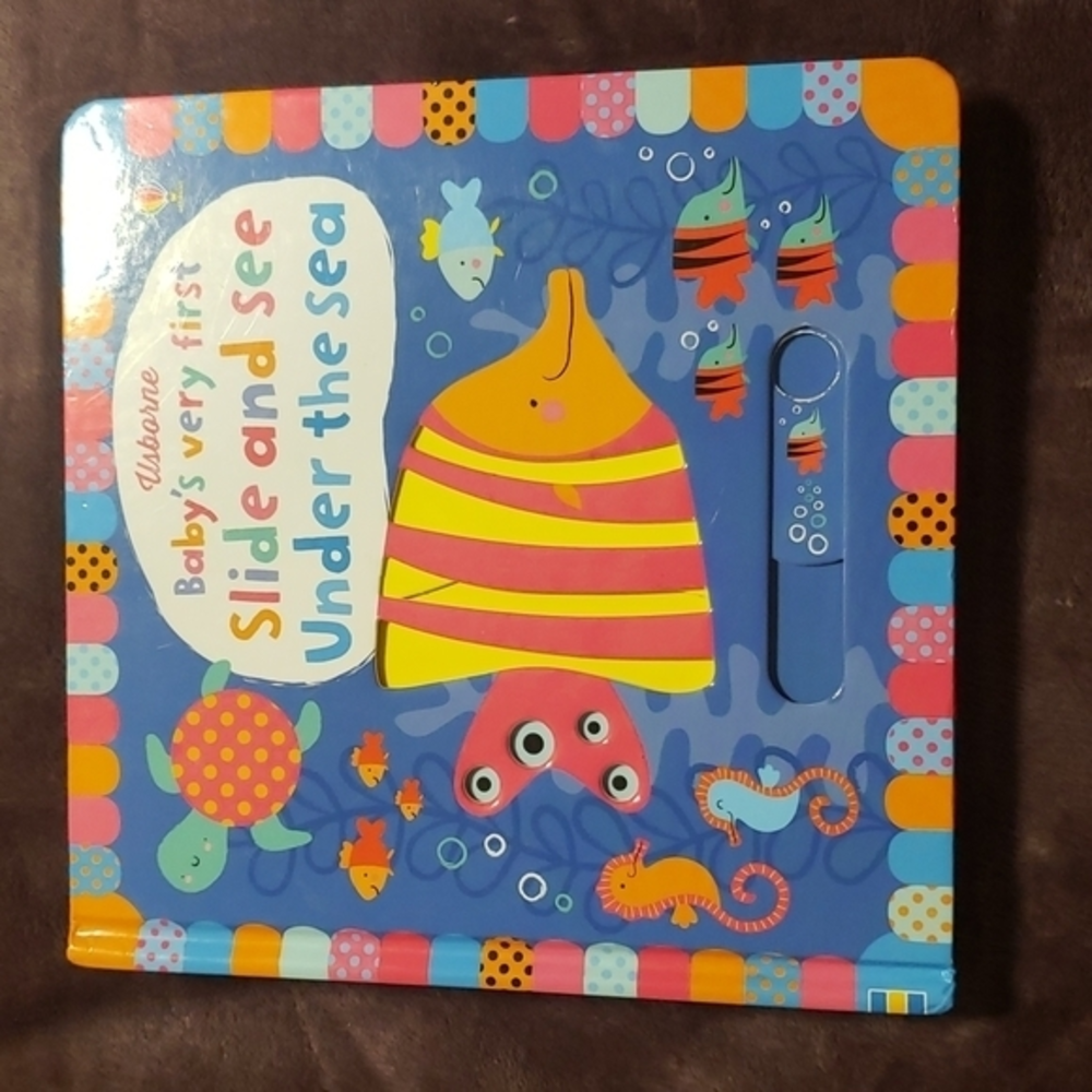 Children's hardboard book with slide and‎ see activities